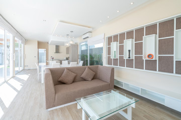 real estate , luxury interior design in living room of pool villas. Airy and bright space with high raised ceiling and dining table