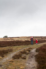 Obraz premium father and daughter walking on the heath