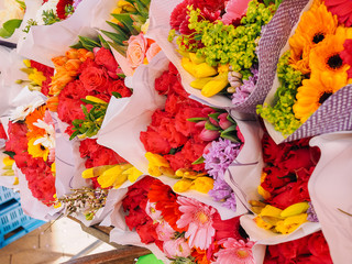 Assortment of bouquets of colorful tulips in a flower shop.