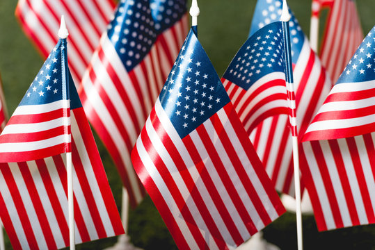 selective focus of american flags with stars and stripes