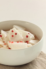 chopped Japanese radish Daikon and red pepper in vinegar