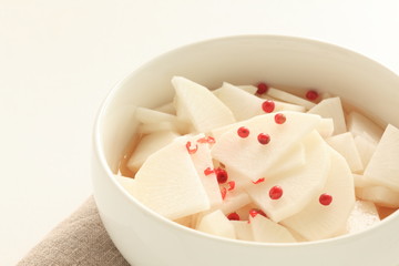 chopped Japanese radish Daikon and red pepper in vinegar