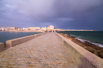 Twilight in Cadiz city Andalusia Spain Caleta beach and San Sebastian castle