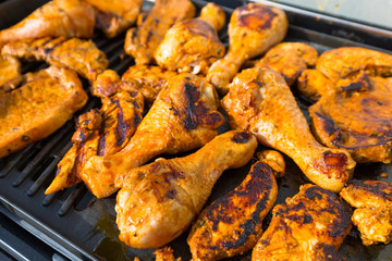 Assorted meat from chicken and pork on barbecue grill