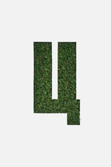 top view of cyrillic letter with green grass on background isolated on white