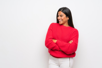 Obraz premium Young Colombian girl with red sweater smiling