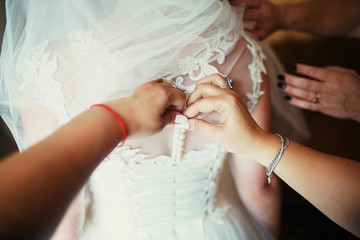Bride tie a wedding dress