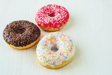 Donuts with icing on white background