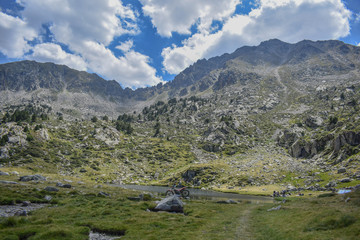 A stunning view of the lake at the peak of El Cubil Petit, in Encamp, Andorra