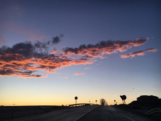 Naklejka na ściany i meble sunset on the road