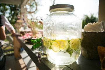 Bank of lemonade with sliced citrus