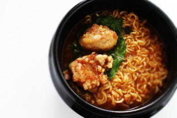 Korean food, fried chicken in hot pot ramen noodles