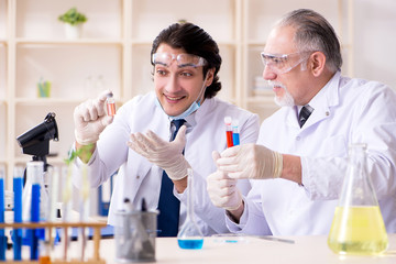 Two chemists working in the lab