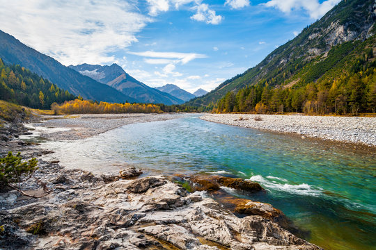 The Lech River flowing through the Alps in Autumn, Tirol, Austria