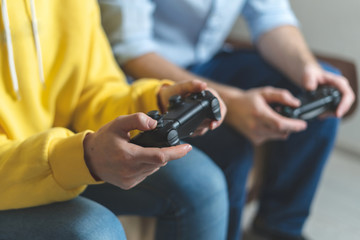 Two person playing at video games at home