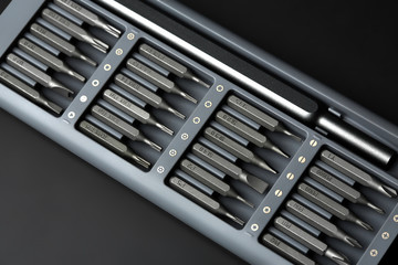 Set of bits for screwdriver. Metal bits for screwdriver. Tool set for household use. Nozzles and adapters for screwdrivers. Head different size hex driver.