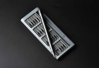 Set of bits for screwdriver. Metal bits for screwdriver. Tool set for household use. Nozzles and adapters for screwdrivers. Head different size hex driver.