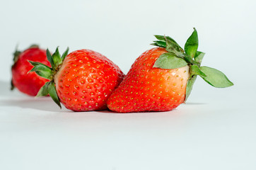  fresh strawberries. white background. crop 2019. one or several