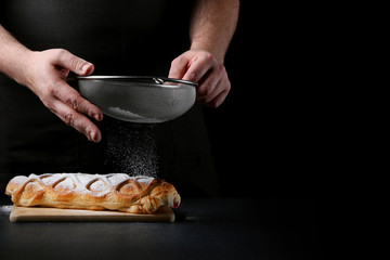 strudel on dark background. baker cooking concept