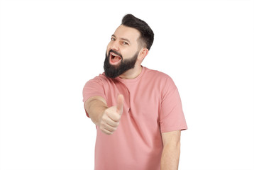 A cute young bearded man shows emotionally