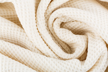 Fototapeta premium White corrugated cotton textile - close up of fabric texture. Cotton Fabric Texture. White Clothing Background. Text Space. Abstract background and texture for designers.