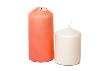 Wax colored candle isolated on white background close up