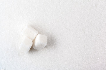  scoop with white sand and lump sugar close up background