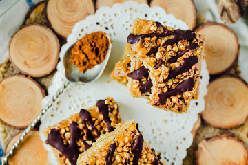 Granola Bars, Healthy Homemade Snack, Superfood Bars with Cranberry, Pumpkin Seeds, Oats, Chia and Flax Seed on rustic background. Top view.