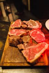 Cheesy steaks on a wooden tray