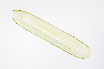 fresh green cucumber slice on grey background