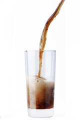cola pouring in glass isolated on white background