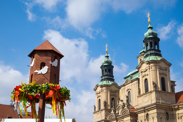 Celebrate easter on Old Town square. View on a Church of St. Nicholas