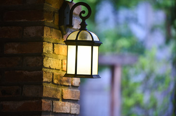 Vintage lantern wall brick decorate home and lamp garden background