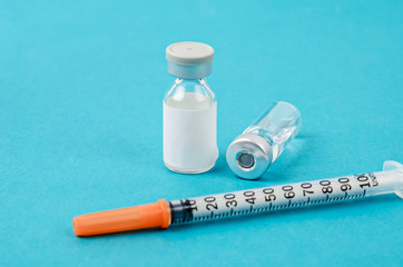 Vaccine vial dose with needle syringe, medical concept vaccination.