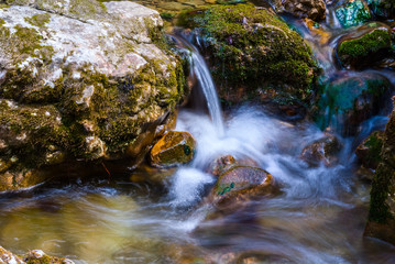 small waterfall on the mountain river
