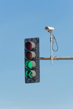 Traffic video camera next to a traffic light