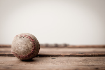 Old, Well-Used Baseball on Vintage Wood Trunk - Room for Text