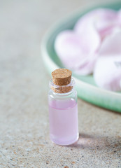 rose water in a glass bottle