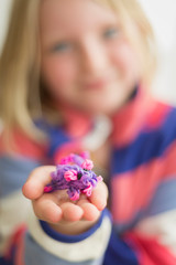 Little girl with loom bands
