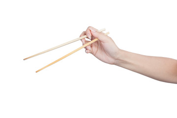 Female hand holding wooden chopsticks