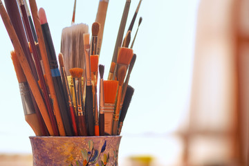 Paint brushes in a glass
