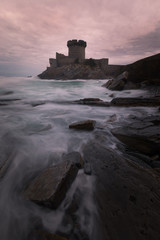 Fototapeta na wymiar Little castle surronded by the brave Atlantic Ocean at Sokoa (Socoa) in the Donibane Lohitzune bay (Saint Jean de Luz) at the Basque Country.