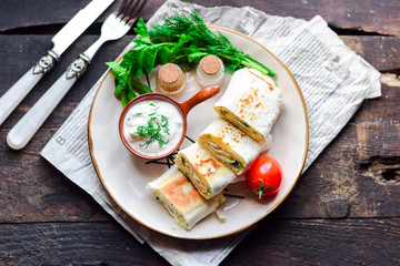 Lavash roll with cheese, herbs and sour cream.