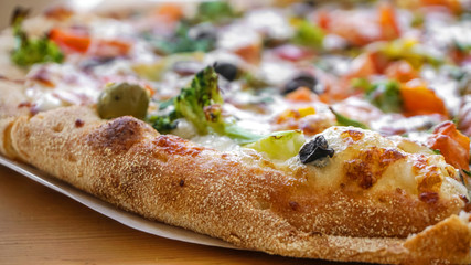 Vegetarian pizza closeup. Appetizing crisp freshly baked pizza.    