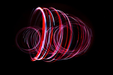 Light painting of red and continuous white spirals forming a 3D shape. Dynamic time trajectory of two lights simultaneously. © Maarten Zeehandelaar