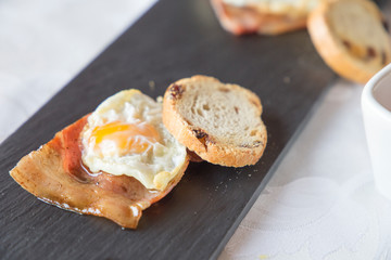 Gourmet breakfast in hotel little egg  with crispy bacon and bread