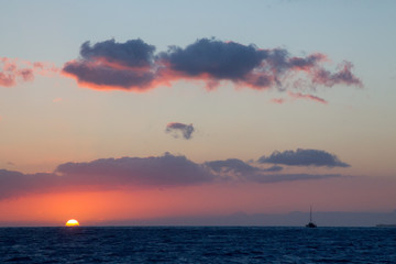 Sunset over the pacific ocean on Kauai, Hawaii, USA.