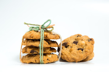 A stack of chocolate chip cookies isolated on a white background