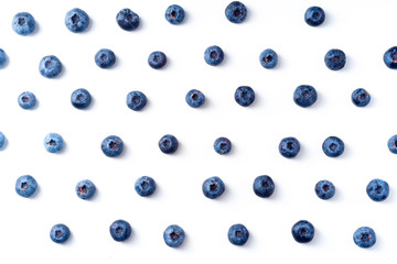 Flatlay pattern with fresh ripe blueberries isolated on white background