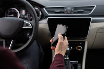 Close up of man using navigation in his car